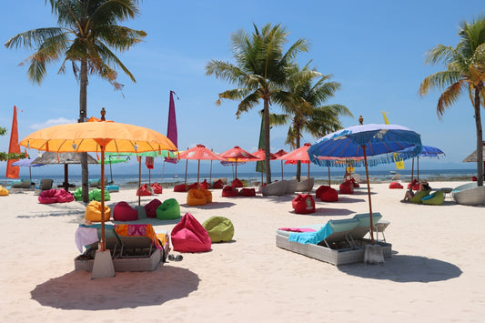 a bunch of umbrellas that are on a beach